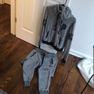 PINK sweat outfit with faux leather zip pockets.